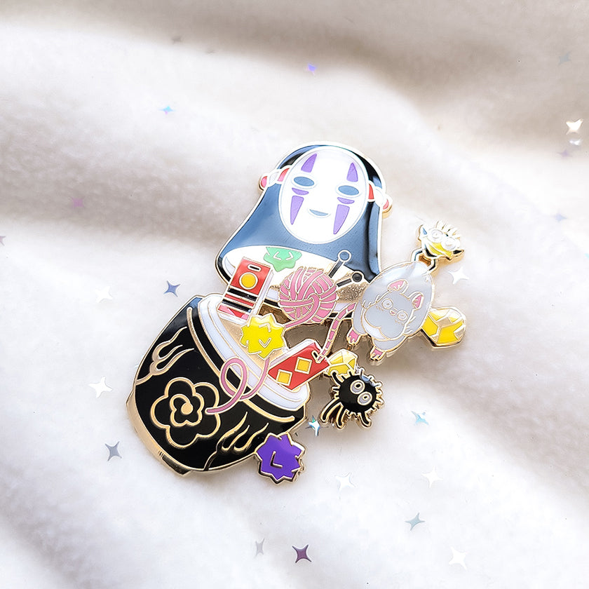 NO FACE NESTING DOLL ENAMEL PIN